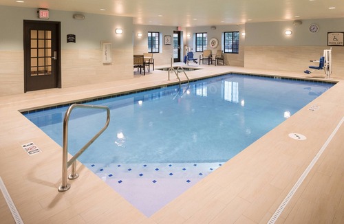 West Omaha Condo | King Suite. Free Breakfast. Pool & Hot Tub. Near the Nebraska Medical Center!