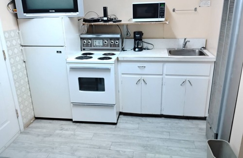 Merritt Hotel | Kitchenette with in room modem hardwired internet.