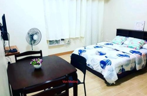 Mandurriao Apartment | Lafayette Park Square with balcony facing pool view
