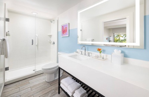 New Town Hotel | Laid-Back Luxe | Pools, Comfort Foods, Lawn Games & Shuttle to Fun