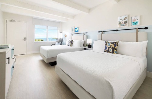 New Town Hotel | Laid-Back Luxe | Pools, Comfort Foods, Lawn Games & Shuttle to Fun