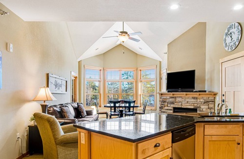 Three Lakes Condo | Lake-view condo with pool and hot tub access, jetted tub, firepit, and a balcony