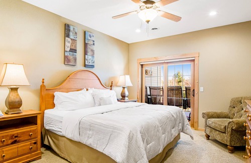 Three Lakes Condo | Lake-view condo with pool and hot tub access, jetted tub, firepit, and a balcony