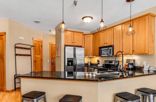 Three Lakes Condo | Lake-view condo with patio, fireplace, hot tubs, pools, firepit, gym, golf & W/D