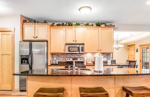 Three Lakes Condo | Lake view condo with 2 balconies, fireplace, pool, hot tubs, gym & sports courts