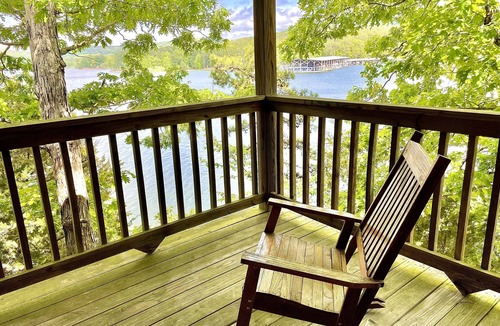 Mount Ida Cottage | Lake view three bedroom, three bath log-sided cottage with private hot tub overlooking Lake Ouachita. by RedAwning