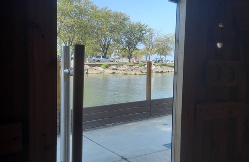 Huron Cabin | Lakefront 1928 Log Cabin w/Sauna, Docking, Fishing, Patio, Big Yard & Balcony
