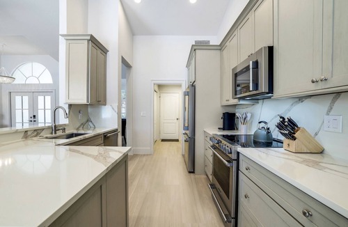 Central Naples House | Lakefront 3-bedroom pool house in Briarwood. Morning sunrise!