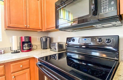 North Myrtle Beach Condo | Lakefront at Barefoot Resort w Massive Waterfront Pool Close to Beach