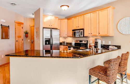 Three Lakes Condo | Lakefront condo with fireplace, hot tubs, heated pool, tennis, gym, firepit, AC