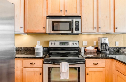 Three Lakes Condo | Lakefront condo with fireplace, hot tubs, heated pool, tennis, gym, firepit, AC