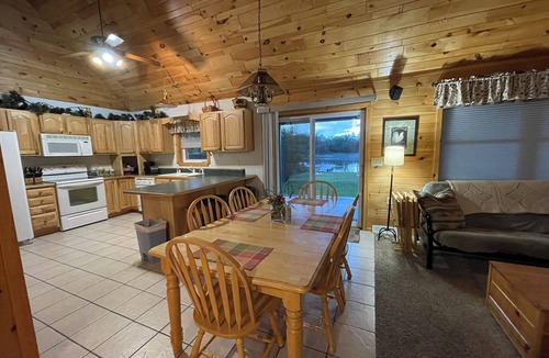 Wetmore Cottage | Lakefront, covered deck, huge backyard with grill, swimming, boat & kayaks!