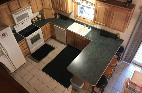 Wetmore Cottage | Lakefront, covered deck, huge backyard with grill, swimming, boat & kayaks!