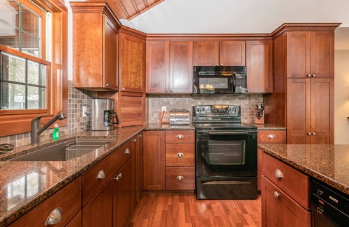 Conover House | Lakefront dog-friendly home with firepit, play set, dock, & beach access