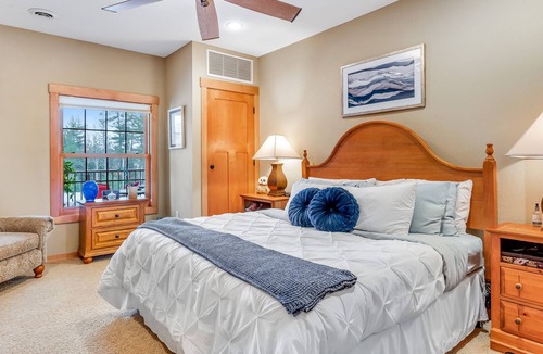 Three Lakes Condo | Lakefront ground-floor condo with balcony, fireplace, W/D, pool & hot tubs