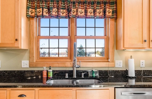 Three Lakes Condo | Lakefront, ground-floor condo with fireplace, patio, private grill & firepit