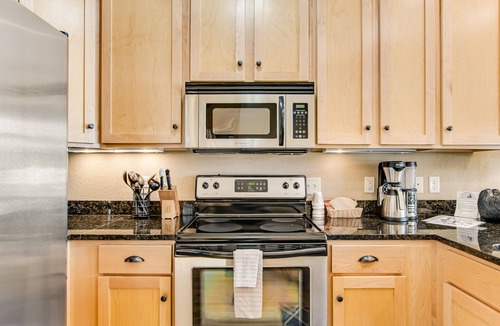 Three Lakes Condo | Lakefront, ground floor condo with indoor pool - fireplace, patio & washer/dryer