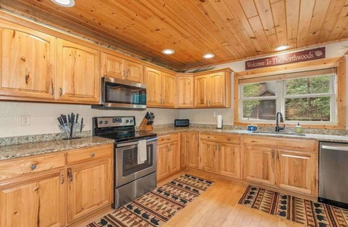Eagle River House | Lakefront home with private dock, firepit, playground & lake views