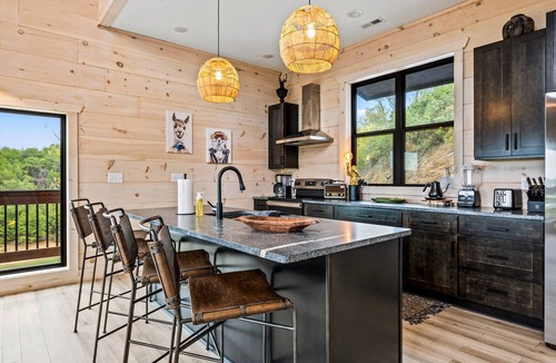 Sevierville Cabin | Lakefront home with retro accents, private pool, and private dock.