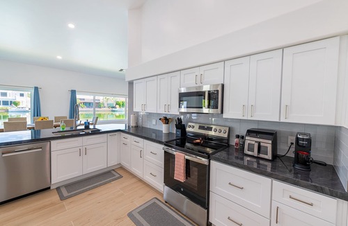 Val Vista Lakes House | Lakefront Lux by HomeSlice Stays