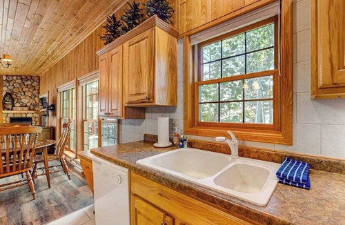 Manitowish Waters Condo | Lakefront resort retreat with screened porch, fireplace, pool, marina, & dining