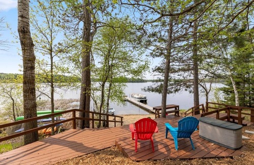 Nevis Cabin | Lakefront retreat on Island Lake. Two cabins, 7 bedrooms, sand beach, privacy+