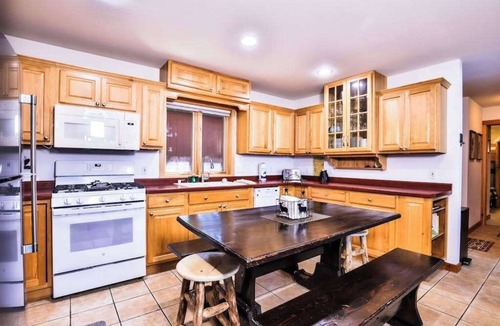 Eagle River House | Lakefront retreat with two full kitchens, fireplaces, washer/dryer, & two docks