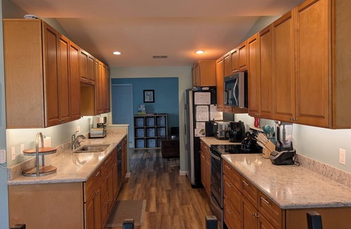 Sand Creek House | Lakeside Beach Getaway with A Gorgeous Kitchen & Dining Room with Room for 10.