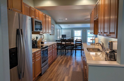 Sand Creek House | Lakeside Beach Getaway with A Gorgeous Kitchen & Dining Room with Room for 10.