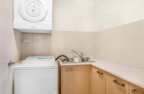 Merrimac Apartment | Lakeside Family Oasis with Pool, Gym and Balcony