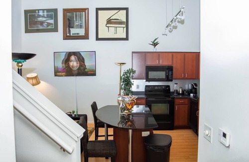 Uptown Condo | Lakeside Haven Minneapolis Loft with BBQ Area, Patio, Central AC, Games, W & D