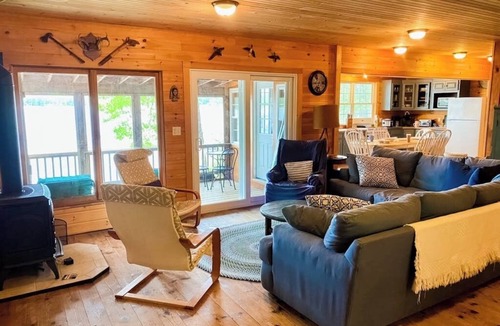 The Bays Cabin | Lakeside home with private dock, firepit, grill, scenic balcony, fireplace & AC