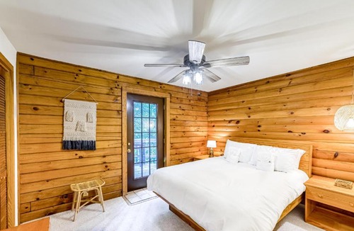 Blue Water House | Lakeside log home with a private deck, WiFi, firepit, central AC, & washer/dryer