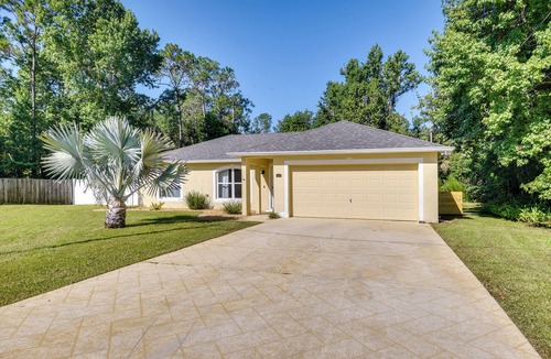 Palm Coast Cottage | Lanai & Fire Pit: Peaceful Palm Coast Home!