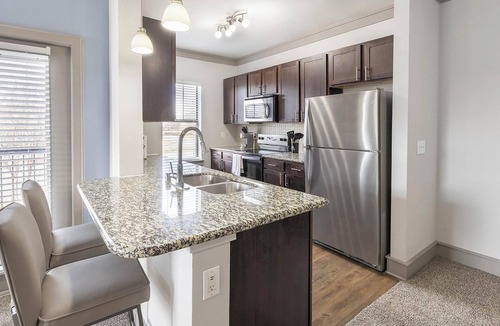 Northeast Carrollton Apartment | Landing | Chic 3BD, Clubhouse