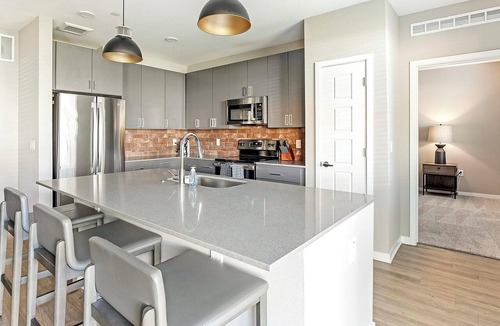 Warehouse District Apartment | Landing | Modern 2BD, Game Room, Rooftop Lounge