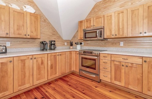 Cape Fear Station House | Large deck on main level and screened in porch, private crofter; access to both clubs!