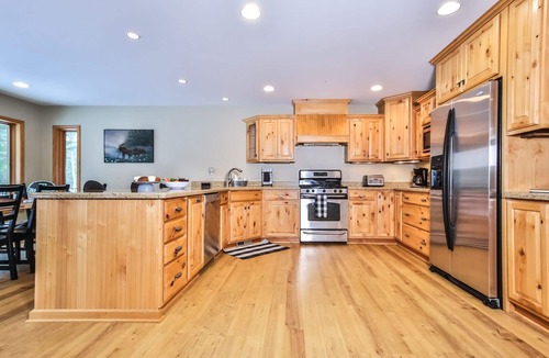St Germain House | Large lakeside home with hot tub, gazebo, dock, firepit, and fenced in yard!