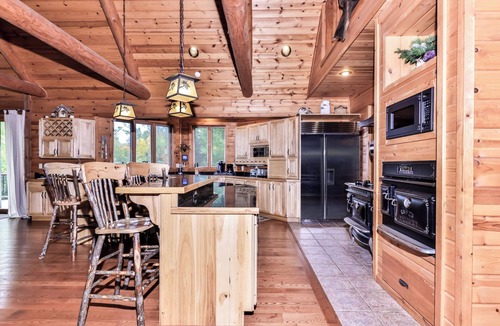 Three Lakes House | Large lakeside log home with air-hockey, foosball, dock, enclosed porch, firepit