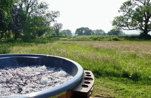 Pentrefelin Cabin | Large luxury shepherd's hut with hot tub in the stunning Welsh countryside.