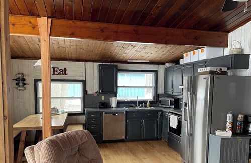 Elk Rapids Cottage | Latitude Adjustment: Lakefront with Beach & Kayaks