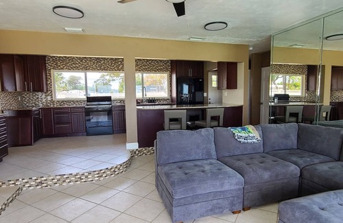 Titusville House | Launch & Lounge: Rocket views, pool and dock