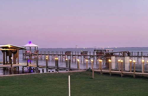 Titusville House | Launch & Lounge: Rocket views, pool and dock