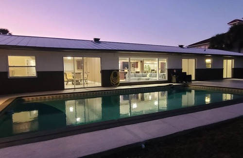 Titusville House | Launch & Lounge: Rocket views, pool and dock