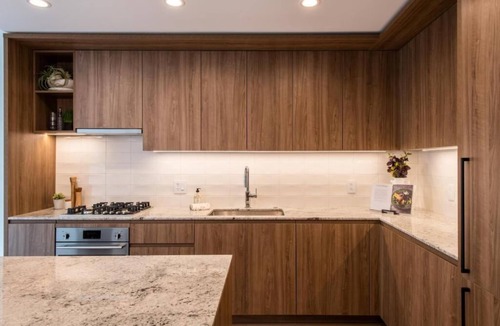 Killgubbin Hotel | Level Spacious one bedroom suite with king bed, walk-in closet, full kitchen.