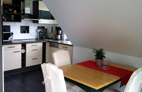 Plau am See Apartment | Light and friendly roof apartment with a patio and balcony