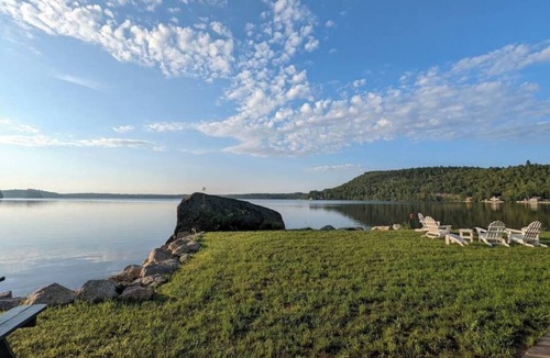 Dedham House | Light-filled lakefront home for up to 15 with private beach and dock near Acadia