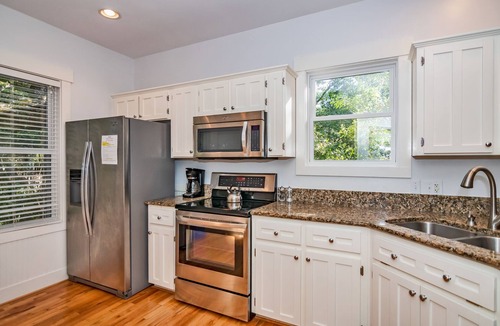 Bald Head Island Cottage | Live oak views from this 3 bedroom cottage; 2 golf carts and peaceful screened in porch