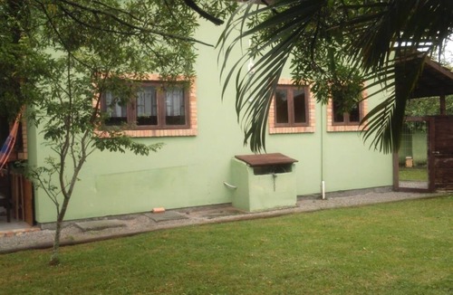 Rio Tavares Ski Chalet | Located 300 meters from the beach, the house faces east and is surrounded by grass.