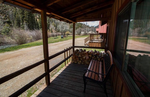 Red River Cabin | Located by the River facing the Mountains